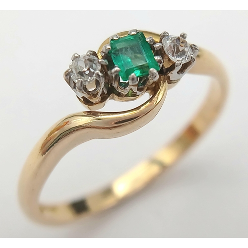 144 - A 18K YELLOW GOLD & PLATINUM DIAMOND & EMERALD 3 STONE TWIST RING. TOTAL WEIGHT 3G. SIZE N. Ref: SC ... 