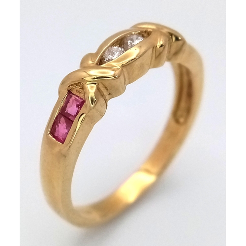 165 - A 18K YELLOW GOLD DIAMOND & RUBY BAND RING. TOTAL WEIGHT 3.2G. SIZE N. Ref: SC 4082