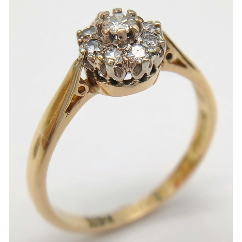 172 - A 18K YELLOW GOLD & PLATINUM VINTAGE DIAMOND CLUSTER RING. 0.25CT. TOTAL WEIGHT 3.2G. SIZE O AND 1/2... 