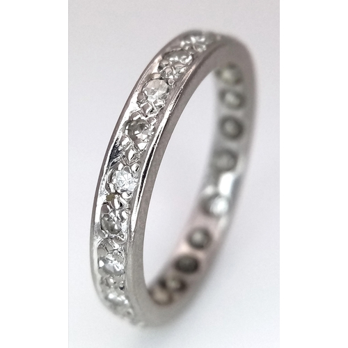 179 - A 18K WHITE GOLD DIAMOND SET FULL ETERNITY RING. 0.30CT. TOTAL WEIGHT 3.3G. SIZE M. Ref: SC 4080