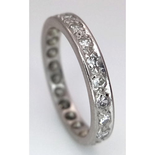 179 - A 18K WHITE GOLD DIAMOND SET FULL ETERNITY RING. 0.30CT. TOTAL WEIGHT 3.3G. SIZE M. Ref: SC 4080