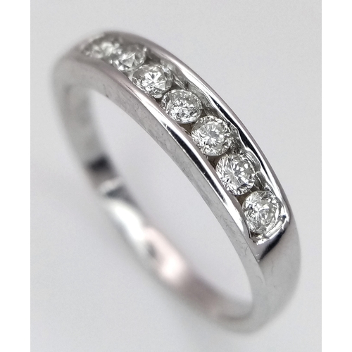 271 - A 18K WHITE GOLD DIAMOND 7 STONE RING. 0.20CT. TOTAL WEIGHT 2.6G. SIZE L. Ref: SC 4067