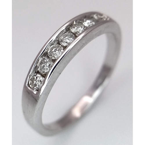 271 - A 18K WHITE GOLD DIAMOND 7 STONE RING. 0.20CT. TOTAL WEIGHT 2.6G. SIZE L. Ref: SC 4067