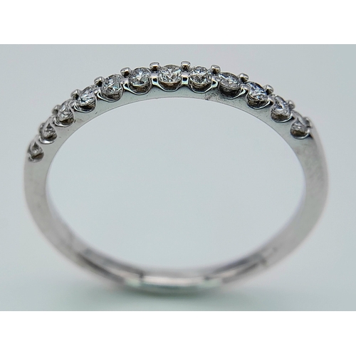 278 - A 18K WHITE GOLD DIAMOND SET 1/2 ET RING. 0.25CT. TOTAL WEIGHT 2.4G. SIZE P. Ref: SC 4070