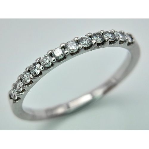 278 - A 18K WHITE GOLD DIAMOND SET 1/2 ET RING. 0.25CT. TOTAL WEIGHT 2.4G. SIZE P. Ref: SC 4070