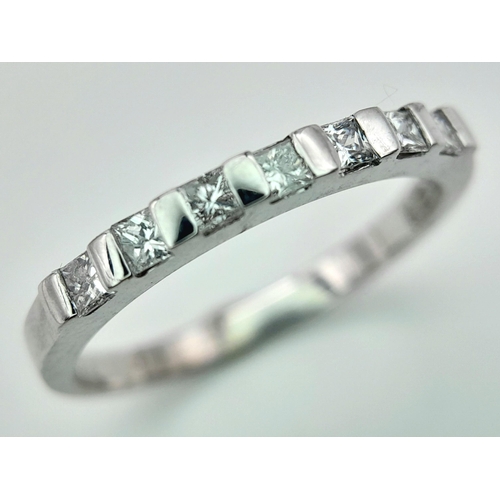 285 - A 18K WHITE GOLD DIAMOND 1/2 ET RING WITH PRINCESS CUTS. 0.25CT. TOTAL WEIGHT 2.6G. SIZE M AND 1/2. ... 