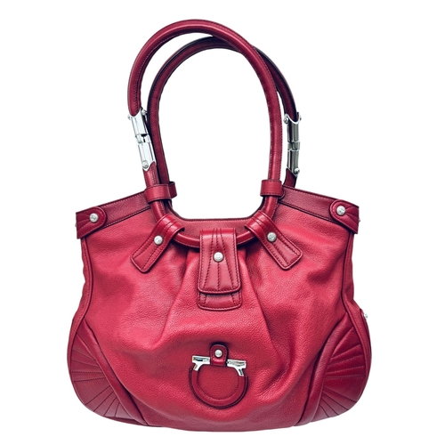 326 - A Salvatore Ferragamo Red Leather Handbag. Saddle form silver tone hardware. Purple textile interior... 