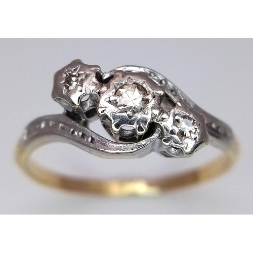 355 - A 18K YELLOW GOLD & PLATINUM VINTAGE DIAMOND TWIST RING. TOTAL WEIGHT 2.7G. SIZE O AND 1/2. Ref: SC ... 