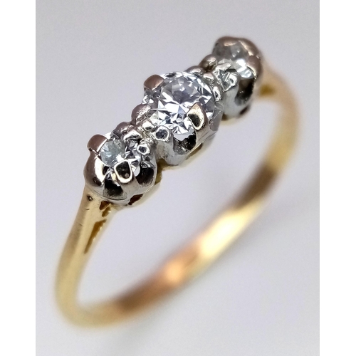 369 - A 18K YELLOW GOLD DIAMOND 3 STONE RING. 0.15CT. TOTAL WEIGHT 1.9G. SIZE J AND 1/2. Ref: SC 4086