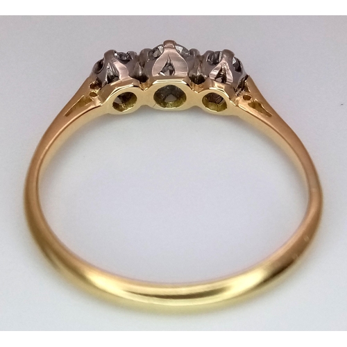 369 - A 18K YELLOW GOLD DIAMOND 3 STONE RING. 0.15CT. TOTAL WEIGHT 1.9G. SIZE J AND 1/2. Ref: SC 4086