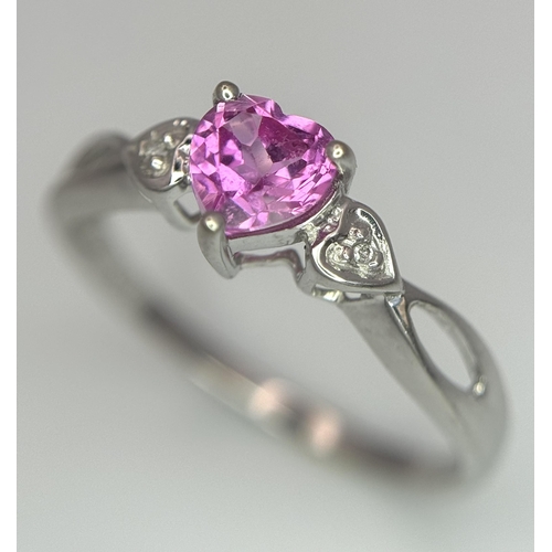 373 - A 9K WHITE GOLD DIAMOND & HEART SHAPED PINK SAPPHIRE RING. APPROX 0.55CT , 1.4G TOTAL WEIGHT , SIZE ... 