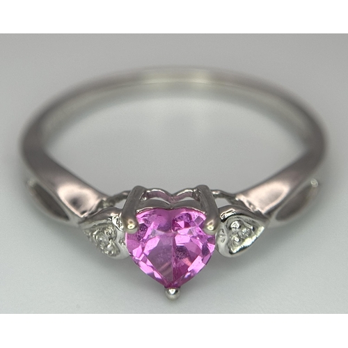 373 - A 9K WHITE GOLD DIAMOND & HEART SHAPED PINK SAPPHIRE RING. APPROX 0.55CT , 1.4G TOTAL WEIGHT , SIZE ... 