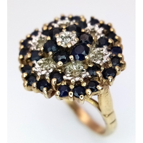 446 - A 9K YELLOW GOLD DIAMOND & SAPPHIRE CLUSTER RING 3.6G SIZE J 1/2. Ref: SC 4002