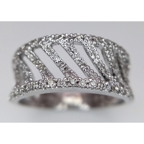 453 - A 9K WHITE GOLD DIAMOND SET FANCY BAND RING 0.25CT 3G SIZE M. Ref: SC 4011