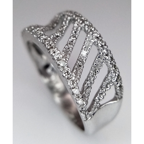 453 - A 9K WHITE GOLD DIAMOND SET FANCY BAND RING 0.25CT 3G SIZE M. Ref: SC 4011