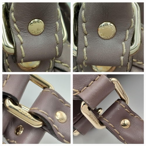 459 - A Gucci Sukey Tote Bag. Mauve leather exterior with GG monogram embossed, light gold-toned hardware,... 