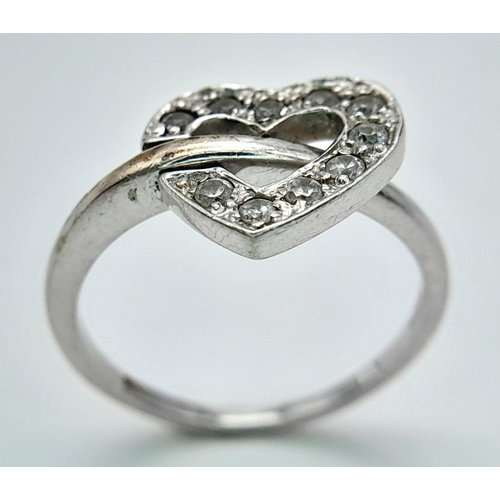 474 - A 9K WHITE GOLD STONE SET HEART RING 3.2G SIZE O. HEART CAN BE FLIPPED TO SHOW PLAIN HEART OPTION. R... 