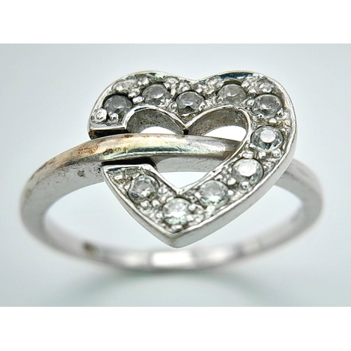 474 - A 9K WHITE GOLD STONE SET HEART RING 3.2G SIZE O. HEART CAN BE FLIPPED TO SHOW PLAIN HEART OPTION. R... 