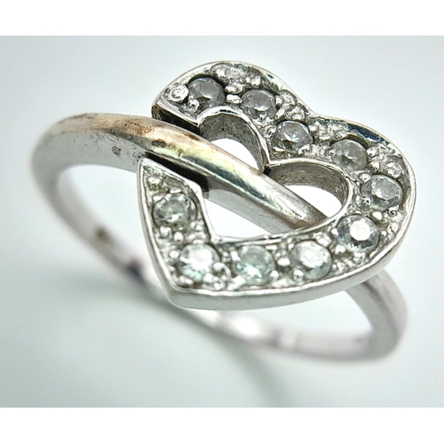 474 - A 9K WHITE GOLD STONE SET HEART RING 3.2G SIZE O. HEART CAN BE FLIPPED TO SHOW PLAIN HEART OPTION. R... 