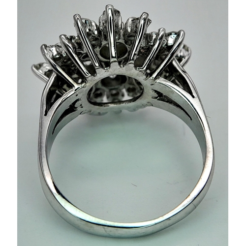 67 - A 18K WHITE GOLD DIAMOND CLUSTER RING. 1CT. TOTAL WEIGHT 6.7G. SIZE K. Ref: SC 4066