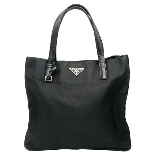 298 - A Prada Black Textile Hand/Shoulder bag. Black leather trim and handles. Removable shoulder strap. T... 