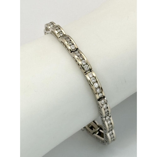 11 - A 14K WHITE GOLD DIAMOND SET BRACELET 1CT APPROX 15.4G IN WEIGHT, 18CM IN LENGTH. Ref: SC 4054