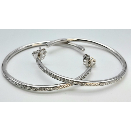 20 - A 18K WHITE GOLD DIAMOND SET HOOP EARRINGS BY DESIGNER LEO PIZZO. TOTAL WEIGHT 11.1G. Ref: SC 4072