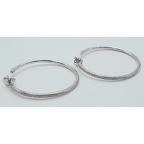 20 - A 18K WHITE GOLD DIAMOND SET HOOP EARRINGS BY DESIGNER LEO PIZZO. TOTAL WEIGHT 11.1G. Ref: SC 4072