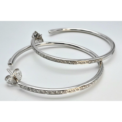 20 - A 18K WHITE GOLD DIAMOND SET HOOP EARRINGS BY DESIGNER LEO PIZZO. TOTAL WEIGHT 11.1G. Ref: SC 4072