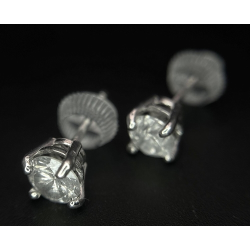 233 - A Pair of 18K White Gold Diamond Stud Earrings. 1ctw of brilliant round cut diamonds. 0.9g total wei... 