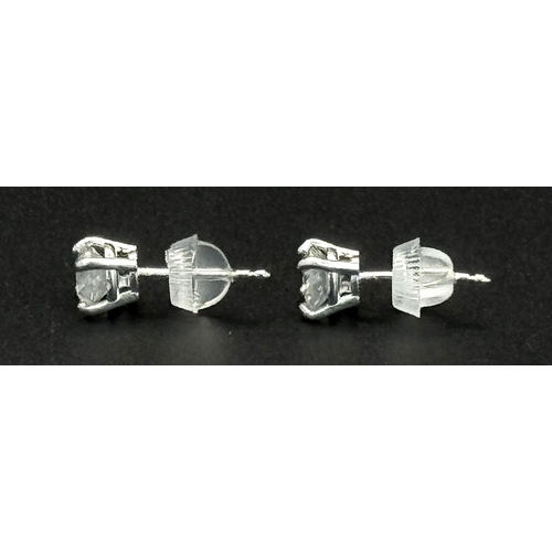 233 - A Pair of 18K White Gold Diamond Stud Earrings. 1ctw of brilliant round cut diamonds. 0.9g total wei... 