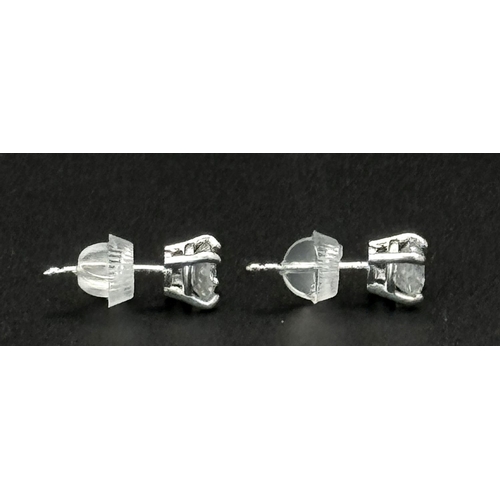 233 - A Pair of 18K White Gold Diamond Stud Earrings. 1ctw of brilliant round cut diamonds. 0.9g total wei... 