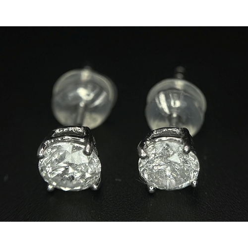 240 - A Pair of 18K White Gold Diamond Stud Earrings. 0.94ctw of brilliant round cut diamonds. 0.96g total... 