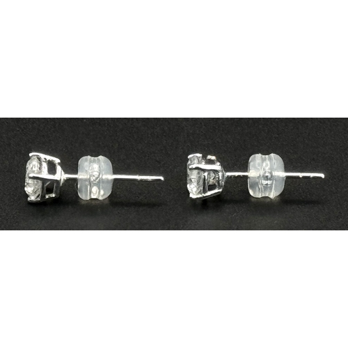 240 - A Pair of 18K White Gold Diamond Stud Earrings. 0.94ctw of brilliant round cut diamonds. 0.96g total... 