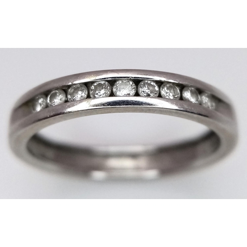 257 - A 18K WHITE GOLD DIAMOND BAND RING. 0.15CT. TOTAL WEIGHT 2.7G. SIZE L. Ref: SC 4064