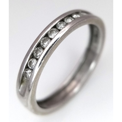 257 - A 18K WHITE GOLD DIAMOND BAND RING. 0.15CT. TOTAL WEIGHT 2.7G. SIZE L. Ref: SC 4064