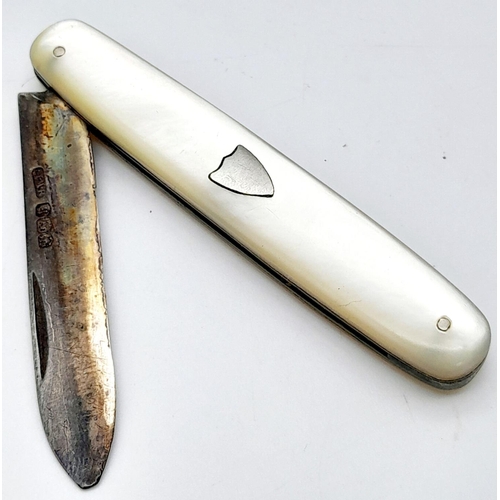 583 - A Sterling Silver and Mother of Pearl Fruit Knife. Hallmarks for Sheffield 1925. 5cm blade length.