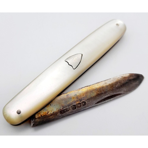 583 - A Sterling Silver and Mother of Pearl Fruit Knife. Hallmarks for Sheffield 1925. 5cm blade length.