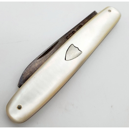 583 - A Sterling Silver and Mother of Pearl Fruit Knife. Hallmarks for Sheffield 1925. 5cm blade length.