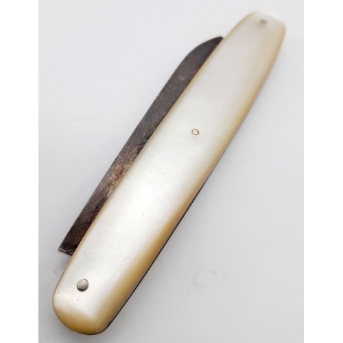 583 - A Sterling Silver and Mother of Pearl Fruit Knife. Hallmarks for Sheffield 1925. 5cm blade length.