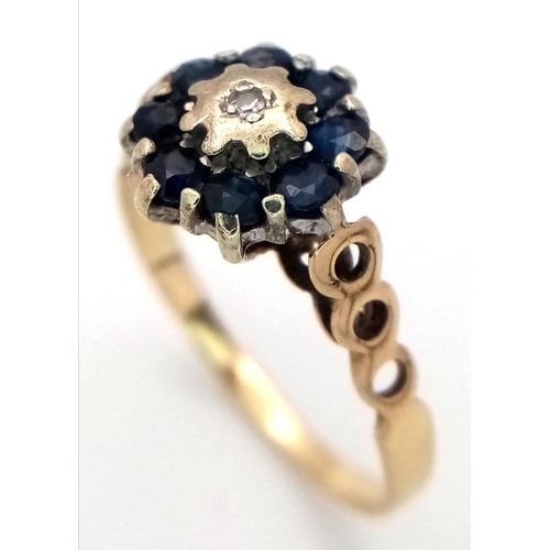 698 - A 9K YELLOW GOLD DIAMOND & SAPPHIRE RING, IN THE FLORAL DESIGN. 1.9G SIZE N 1/2. Ref: SC 4034