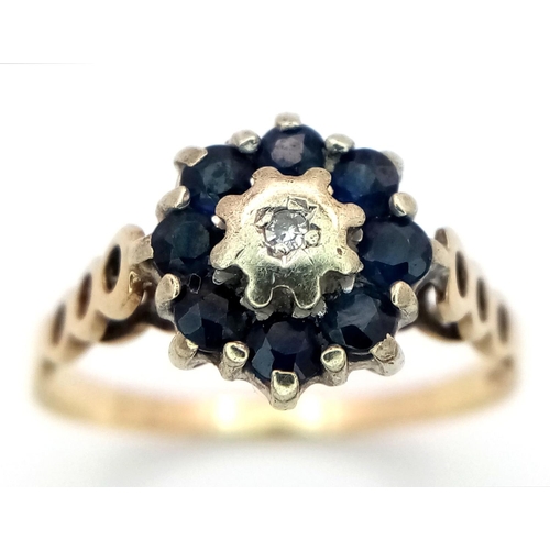 698 - A 9K YELLOW GOLD DIAMOND & SAPPHIRE RING, IN THE FLORAL DESIGN. 1.9G SIZE N 1/2. Ref: SC 4034