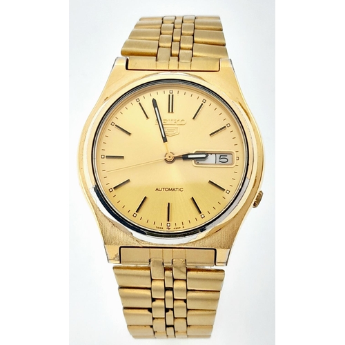 704 - Men’s Seiko 5 Gold Tone Day/Date Automatic Watch. 36mm Case. Working at time of listing.