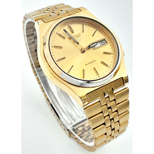 704 - Men’s Seiko 5 Gold Tone Day/Date Automatic Watch. 36mm Case. Working at time of listing.