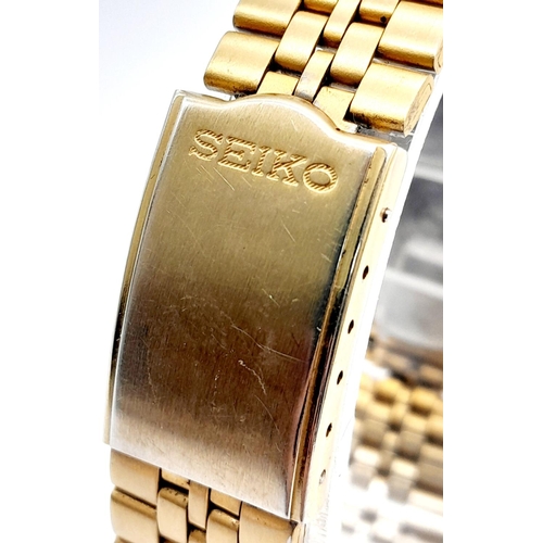 704 - Men’s Seiko 5 Gold Tone Day/Date Automatic Watch. 36mm Case. Working at time of listing.