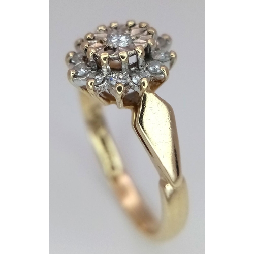 712 - A 9K YELLOW GOLD DIAMOND RING, IN THE FLORAL DESIGN. 0.15CT 2G SIZE J. Ref: SC 4044