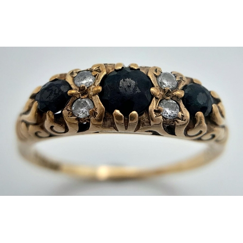 990 - A 9K Yellow Gold Diamond and Sapphire Ring. Three sapphires with diamond accents. Size P. 2.46g tota... 