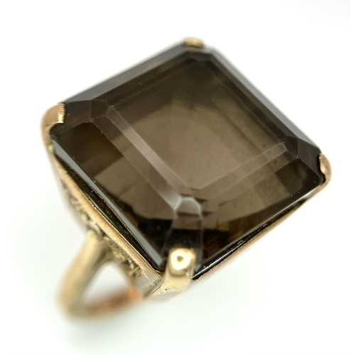 104 - A Vintage 9K Gold Smoky Quartz Ring. Size I. Raised setting. 
13.4g total weight.