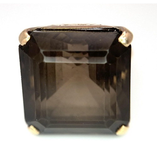 104 - A Vintage 9K Gold Smoky Quartz Ring. Size I. Raised setting. 
13.4g total weight.