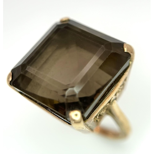 104 - A Vintage 9K Gold Smoky Quartz Ring. Size I. Raised setting. 
13.4g total weight.